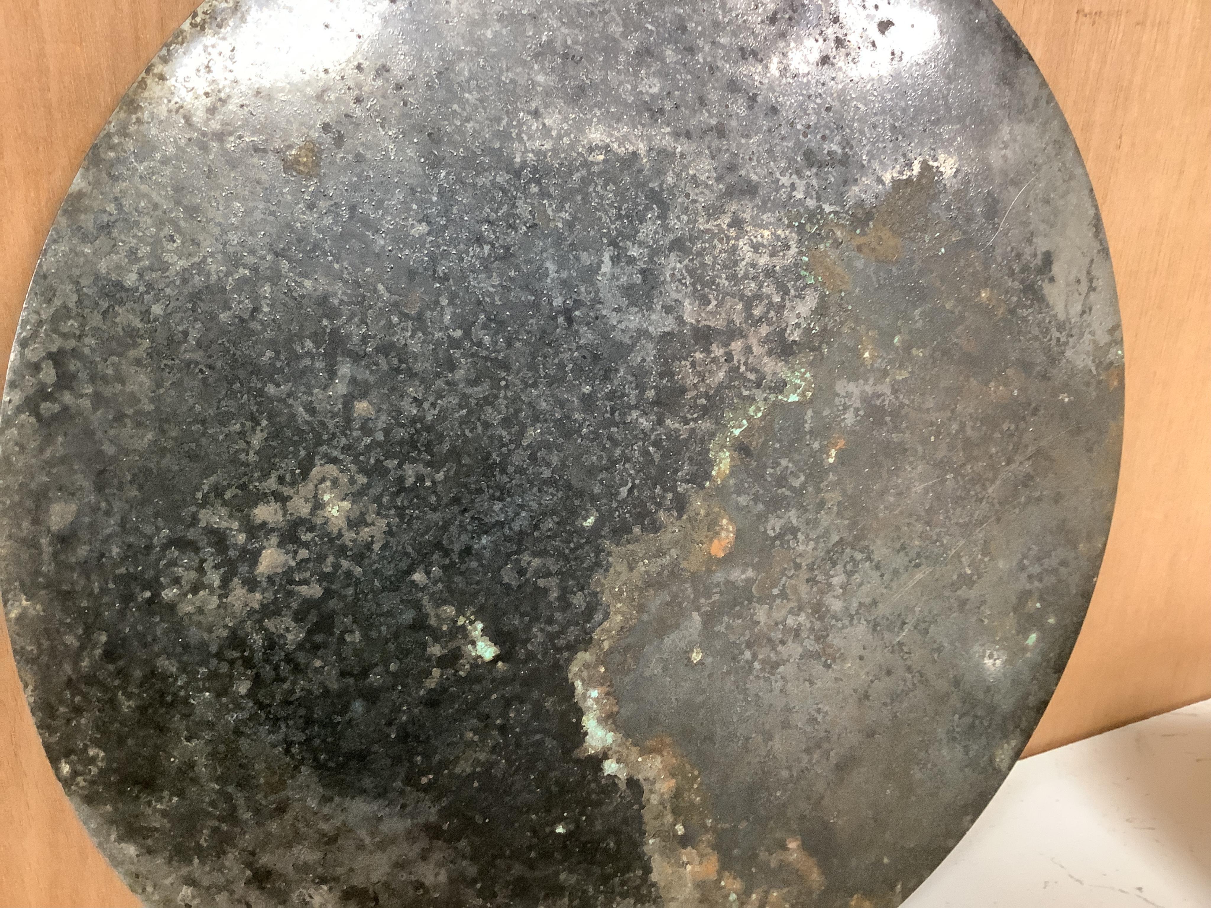 Chinese bronze ‘dragon’ mirror back, 19cm in diameter